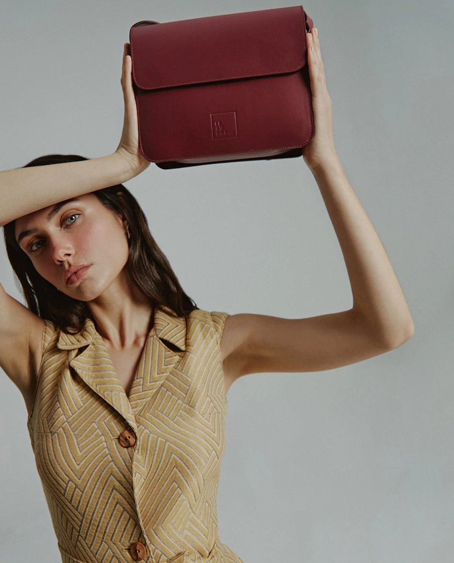 Burgundy leather square crossbody bag with flap