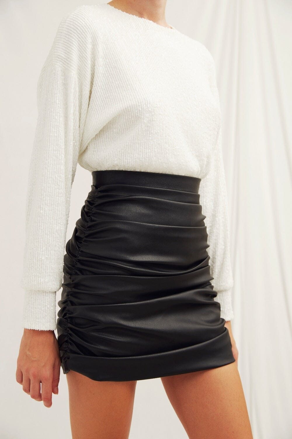 Chels Ruched Vegan Leather Mini Skirt in Black Nazli Ceren