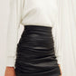 Chels Ruched Vegan Leather Mini Skirt in Black